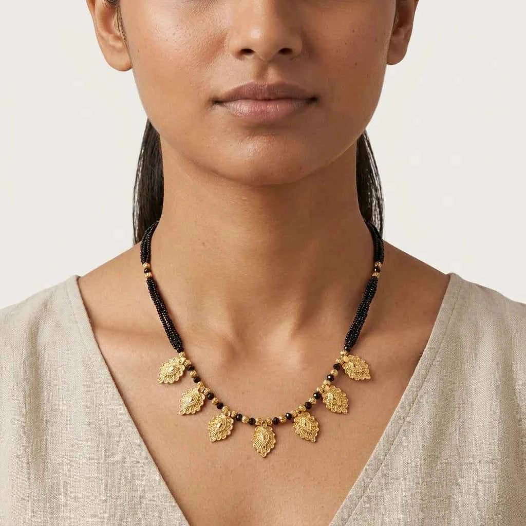 gold plated leaf design short mangalsutra for women | traditional black bead designer necklace