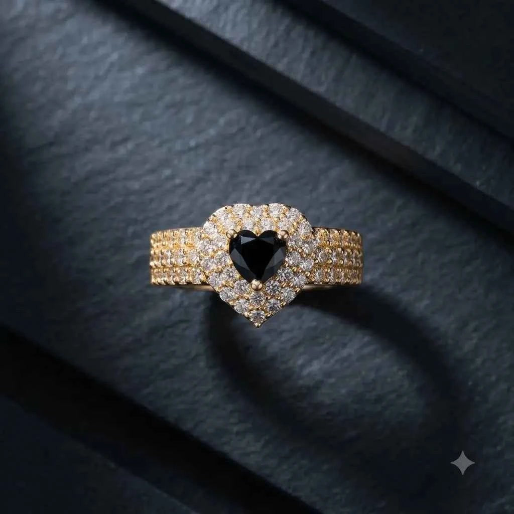gehna official gold plated ring featuring a black heart stone surrounded by sparkling white zircon on a textured band