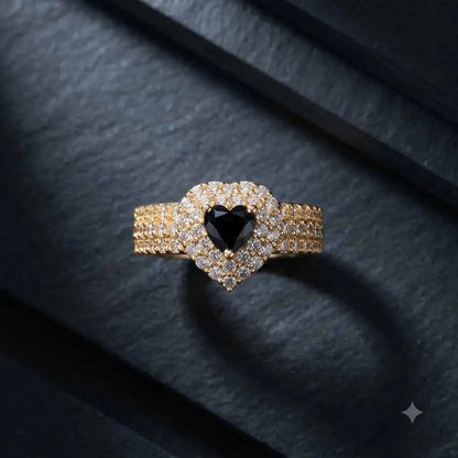 GEHNA OFFICIAL gold plated ring featuring a black heart stone surrounded by sparkling white zircon on a textured band