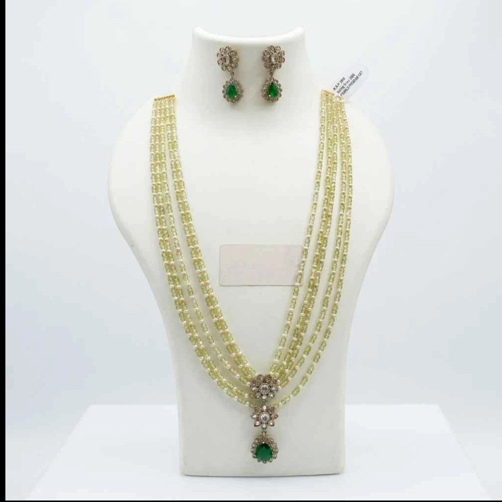 gehna official layered necklace set with green and pearl beads, floral american diamond centerpiece, and matching earrings