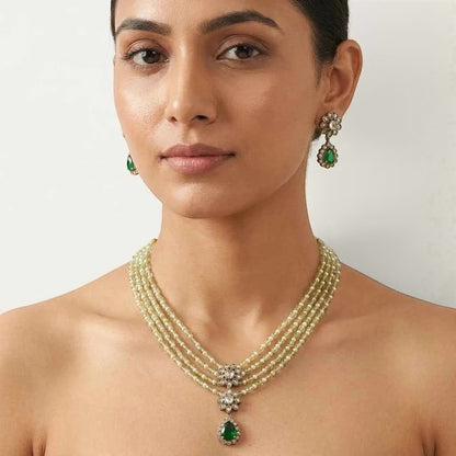 GEHNA OFFICIAL layered necklace set with green and pearl beads, floral American Diamond centerpiece, and earrings.