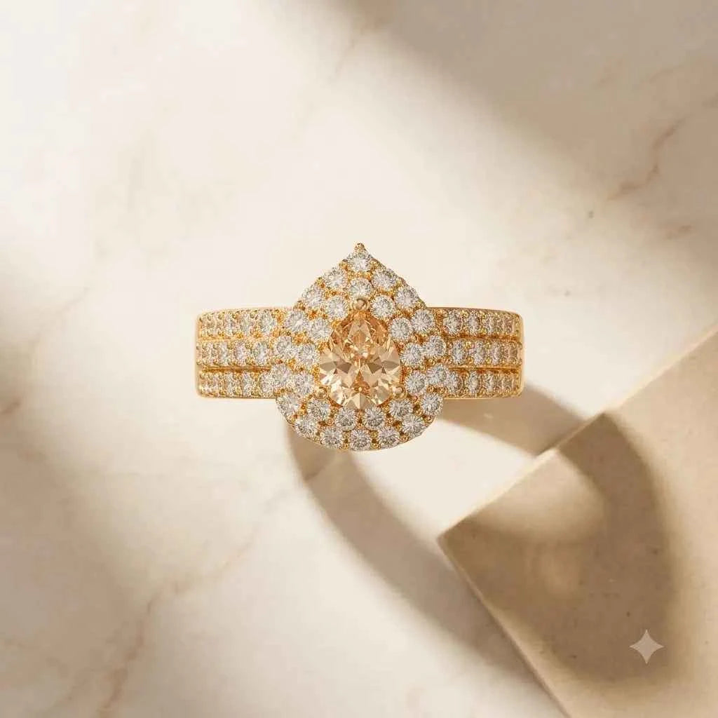 GEHNA OFFICIAL rose gold plated ring featuring a pear-shaped golden stone surrounded by sparkling white zircon accents.