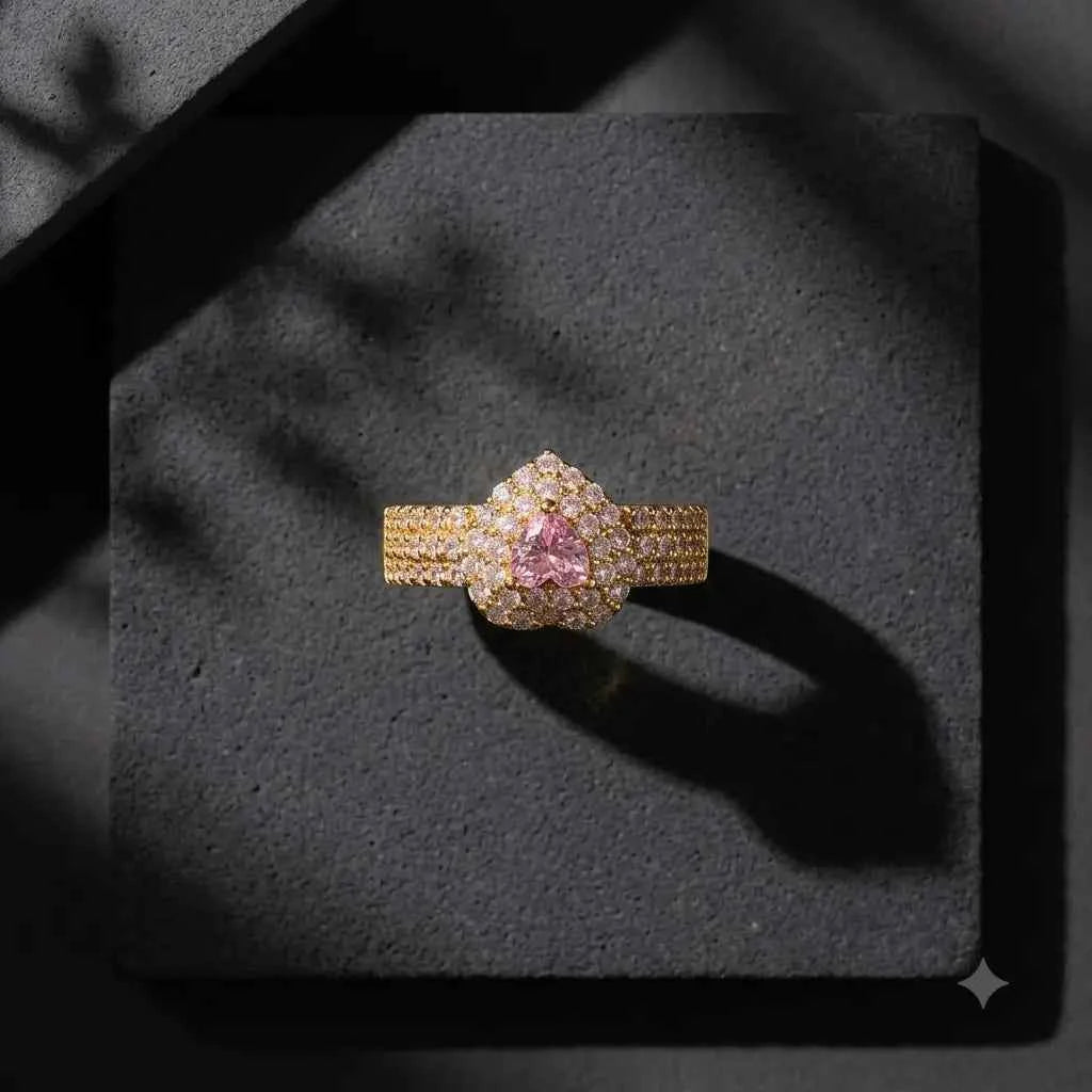 GEHNA OFFICIAL gold plated adjustable ring featuring a heart-shaped pink stone surrounded by sparkling white zircons.