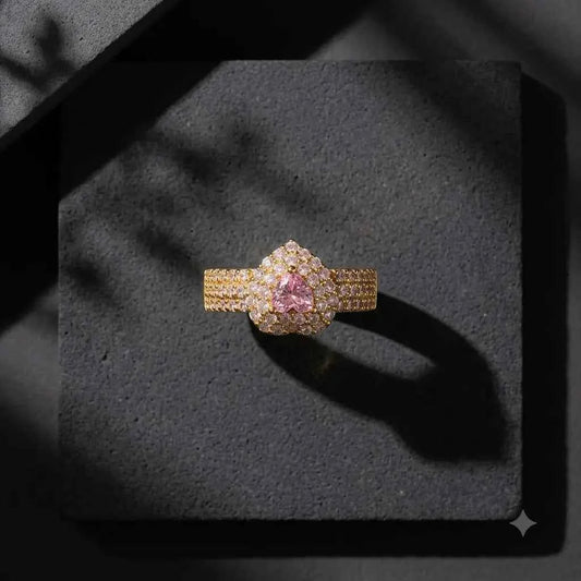 GEHNA OFFICIAL gold plated adjustable ring featuring a heart-shaped pink stone surrounded by sparkling white zircons.