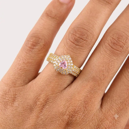 GEHNA OFFICIAL gold plated adjustable ring featuring a heart-shaped pink stone surrounded by shimmering white zircons.