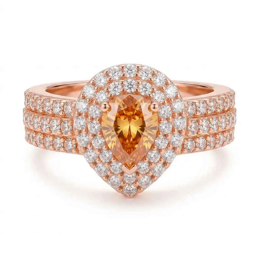 GEHNA OFFICIAL rose gold plated ring featuring a pear-shaped golden stone surrounded by sparkling white zircon stones.